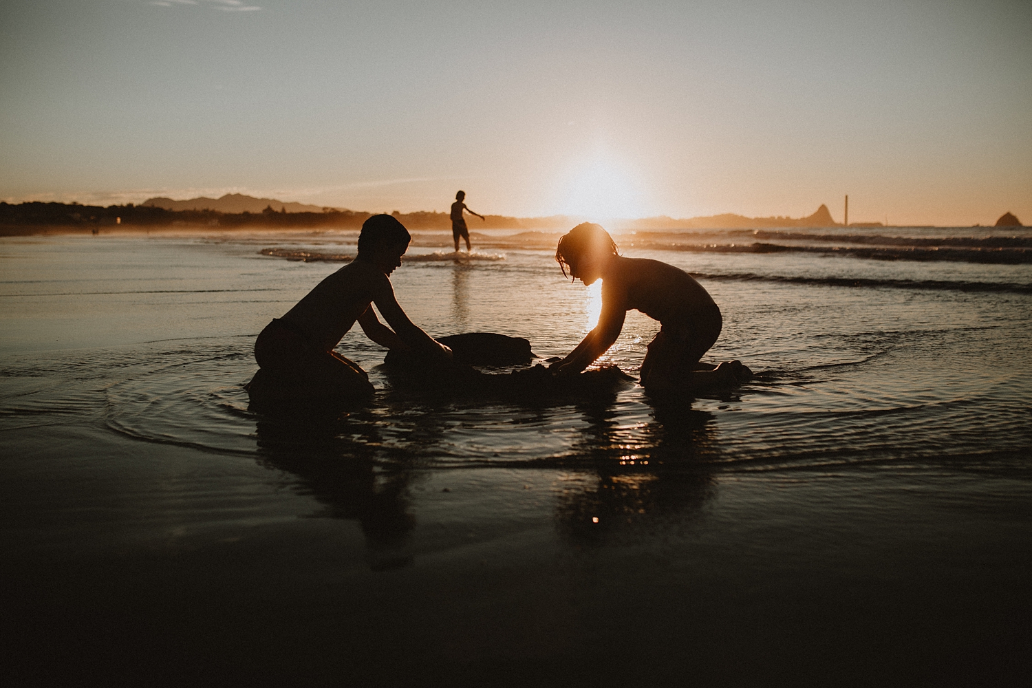 Kids building sand castles at the beach
