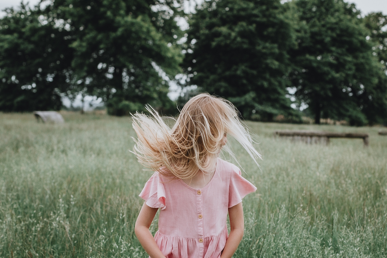 Hair flicking long grass field