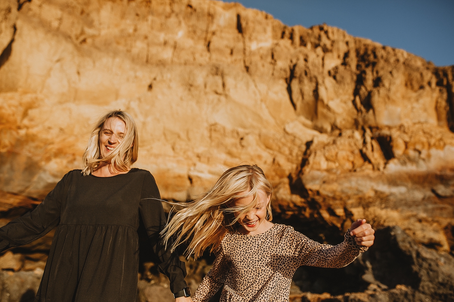 Girl running flicking hair having fun laughing